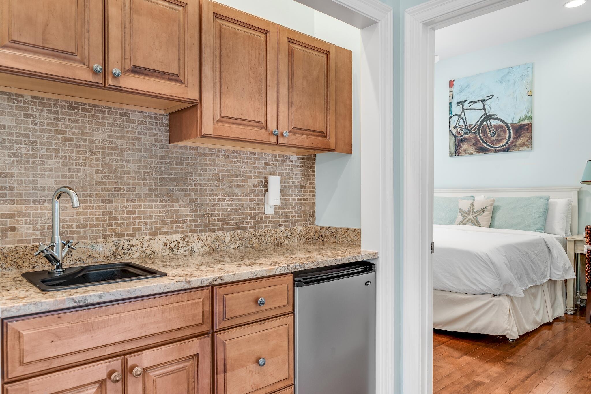 55 The Greenway Loop Panama City Beach, FL 32461 - Photo 20 of 32 a kitchen with a sink and cabinets