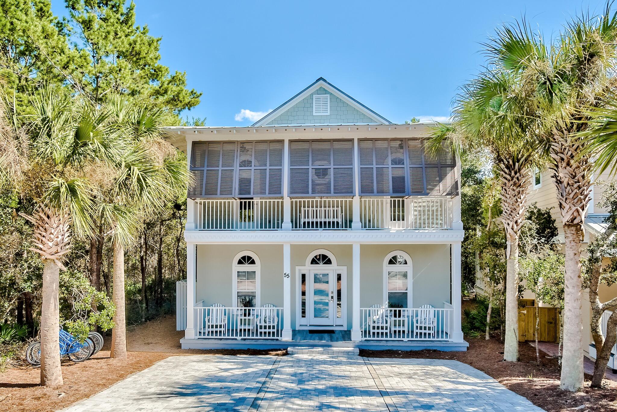 55 The Greenway Loop Panama City Beach, FL 32461 - Photo 31 of 32 a front view of a house with a yard