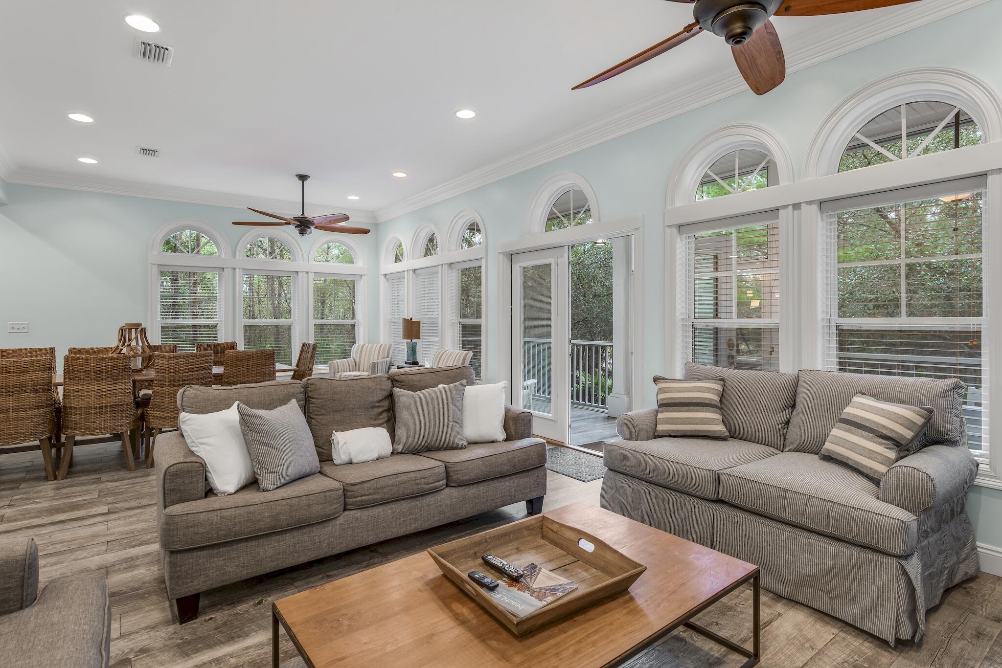 55 The Greenway Loop Panama City Beach, FL 32461 - Photo 4 of 32 a living room with furniture and a large window