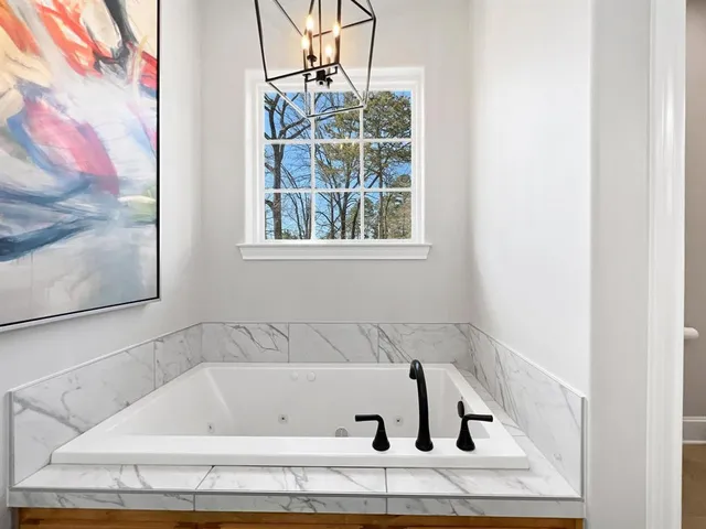 a bath tub sitting next to a window