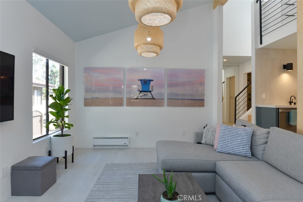 13708 Ruette Le Parc, Unit E Del Mar, CA 92014 - Photo 12 of 30 a living room with furniture and a potted plant