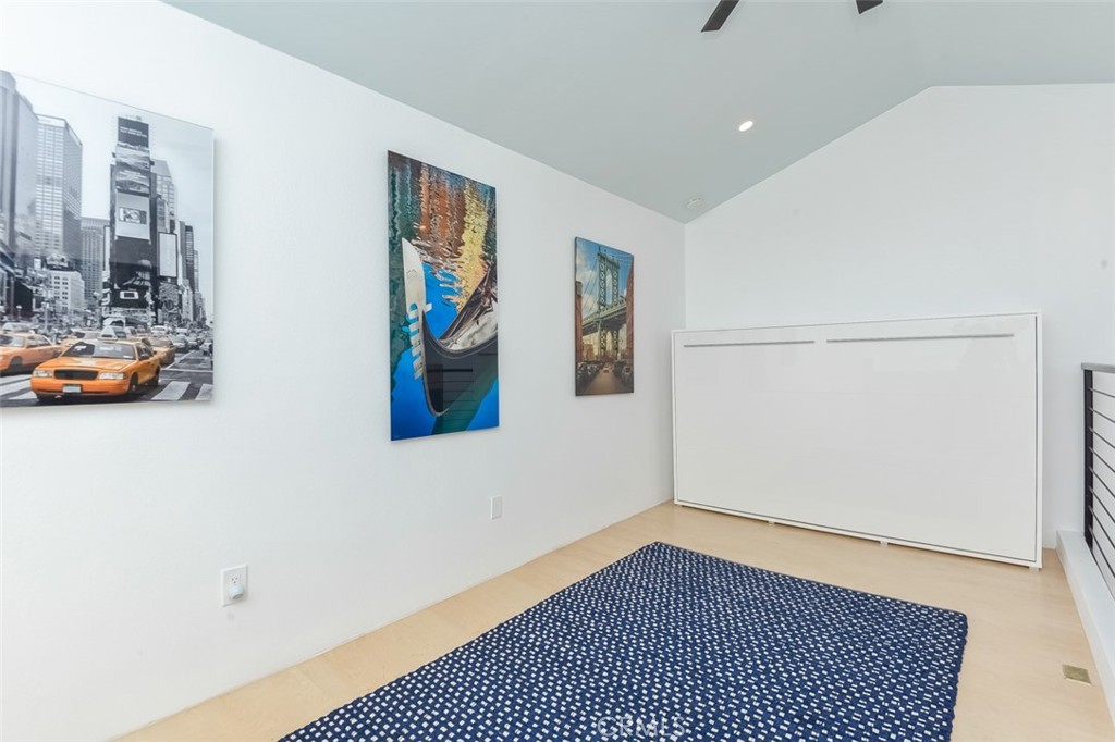 13708 Ruette Le Parc, Unit E Del Mar, CA 92014 - Photo 21 of 30 a view of a room with gym equipment