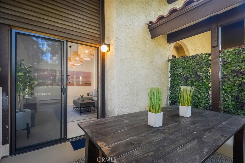 13708 Ruette Le Parc, Unit E Del Mar, CA 92014 - Photo 26 of 30 a view of a dining room with furniture window and outside view