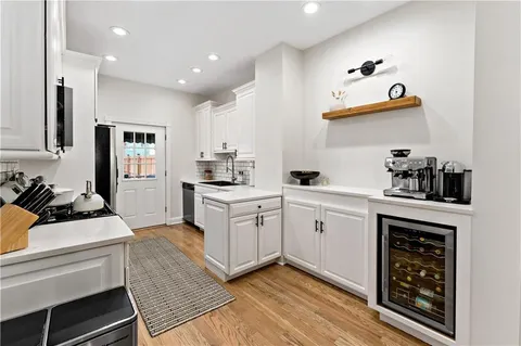 a kitchen with a sink and cabinets