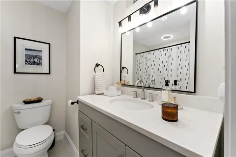 a bedroom with furniture and a chandelier