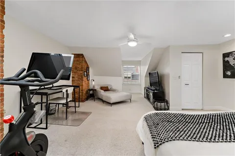 a view of a backyard with sitting area