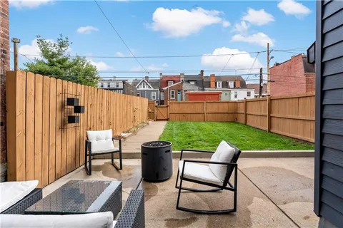 a view of a backyard with potted plants