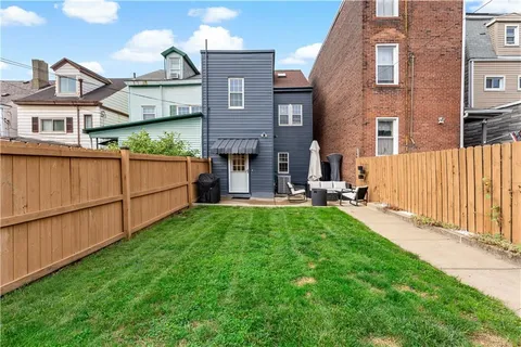 a view of a car parked in front of a house