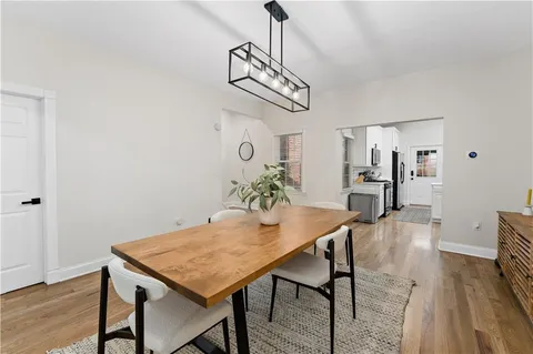 a view of a livingroom with furniture window and wooden floor