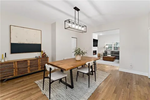a kitchen with white cabinets sink and stainless steel appliances
