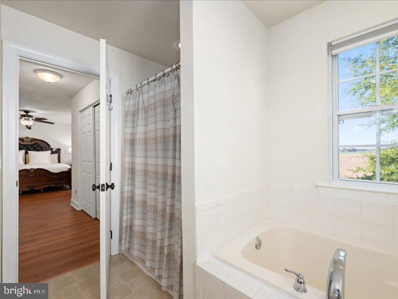 128 West Sheldrake Circle Dover, DE 19904 - Photo 22 of 40 a bathroom with a tub and shower