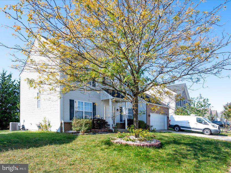 128 West Sheldrake Circle Dover, DE 19904 - Photo 3 of 40 a front view of a house with a yard and large tree