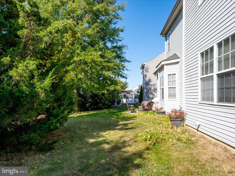 128 West Sheldrake Circle Dover, DE 19904 - Photo 32 of 40 a view of a house with a backyard and a tree