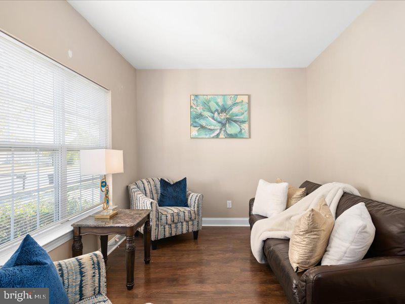128 West Sheldrake Circle Dover, DE 19904 - Photo 5 of 40 a living room with furniture and a large window