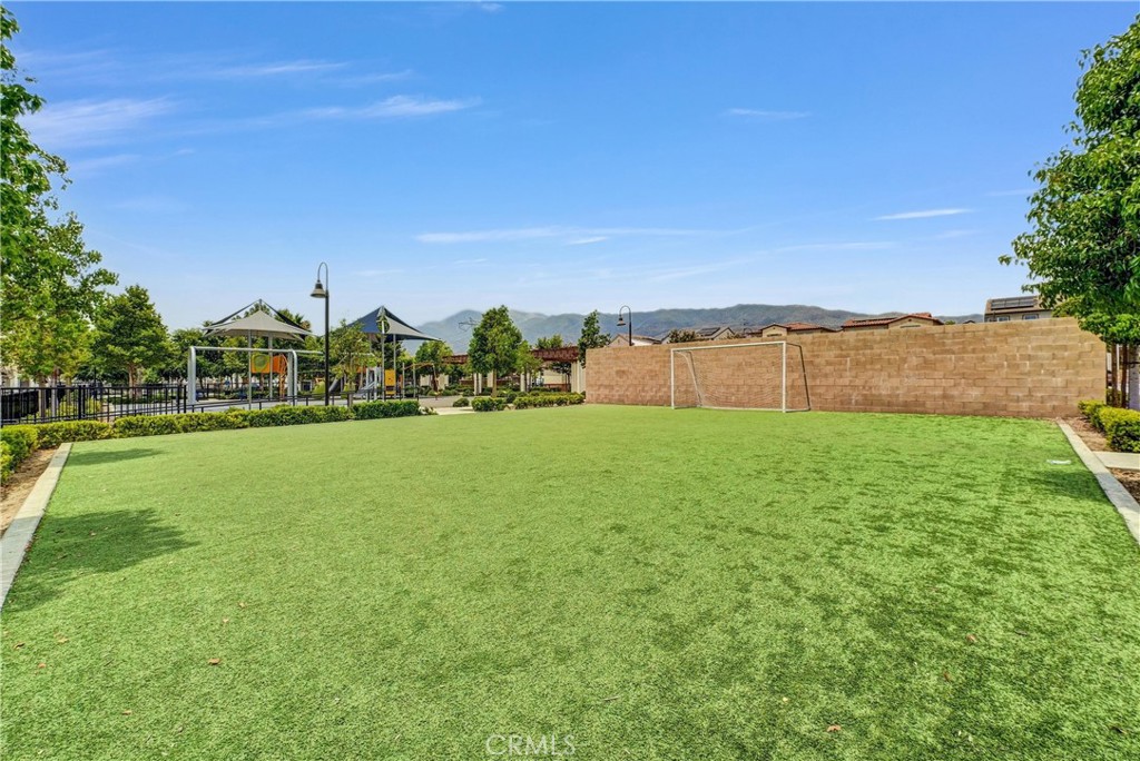 5584 Kate Way, Unit 10 Fontana, CA 92336 - Photo 36 of 42 a view of green field with house in the background