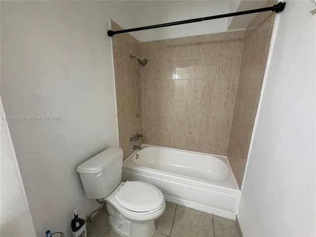 a bathroom with a shower and a toilet