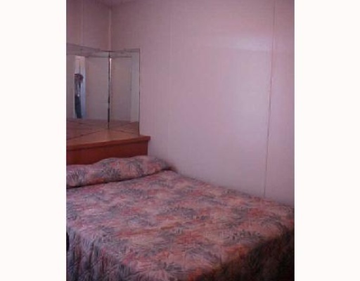 3938 Surfside, Unit 1335 Corpus Christi, TX 78402 - Photo 6 of 6 a bedroom with a bed and a closet