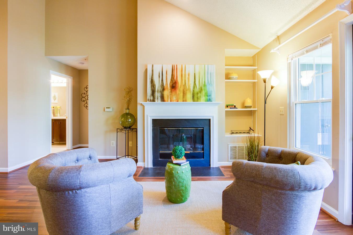 12016 Taliesin Place, Unit 34 Reston, VA 20190 - Photo 11 of 30 a living room with furniture and a fireplace