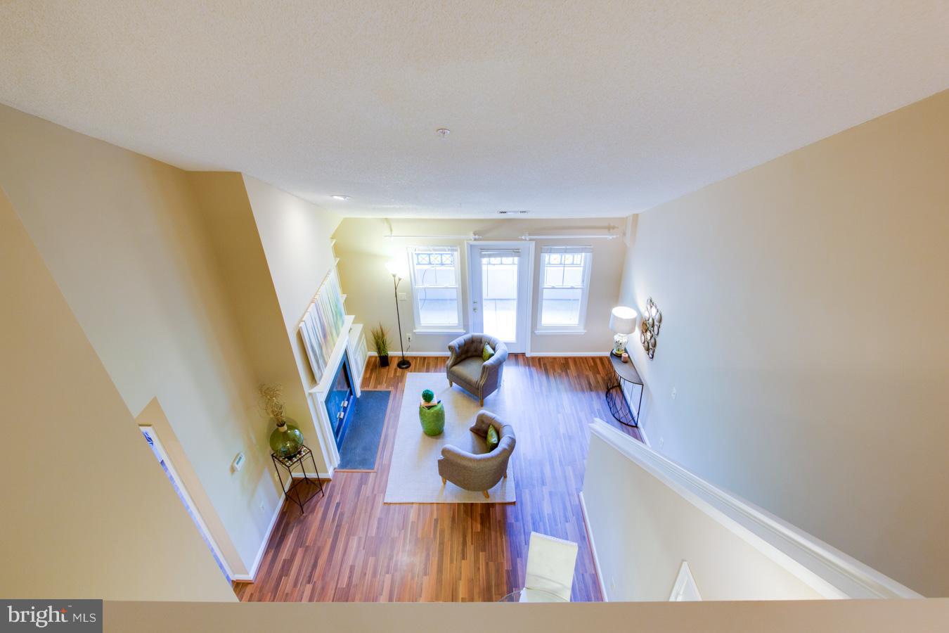 12016 Taliesin Place, Unit 34 Reston, VA 20190 - Photo 22 of 30 a view of living room with furniture and wooden floor
