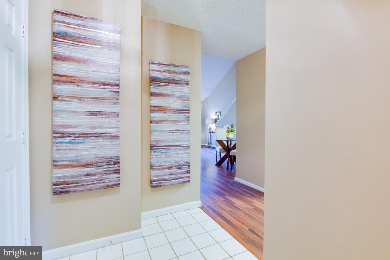 12016 Taliesin Place, Unit 34 Reston, VA 20190 - Photo 4 of 30 a view of walk in closet with clothes and shoes