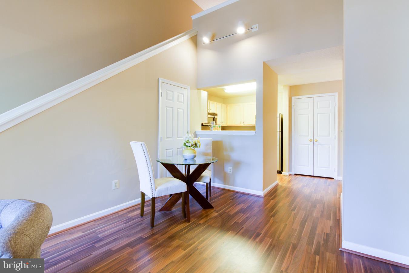 12016 Taliesin Place, Unit 34 Reston, VA 20190 - Photo 10 of 30 a view of a dining room with furniture and wooden floor