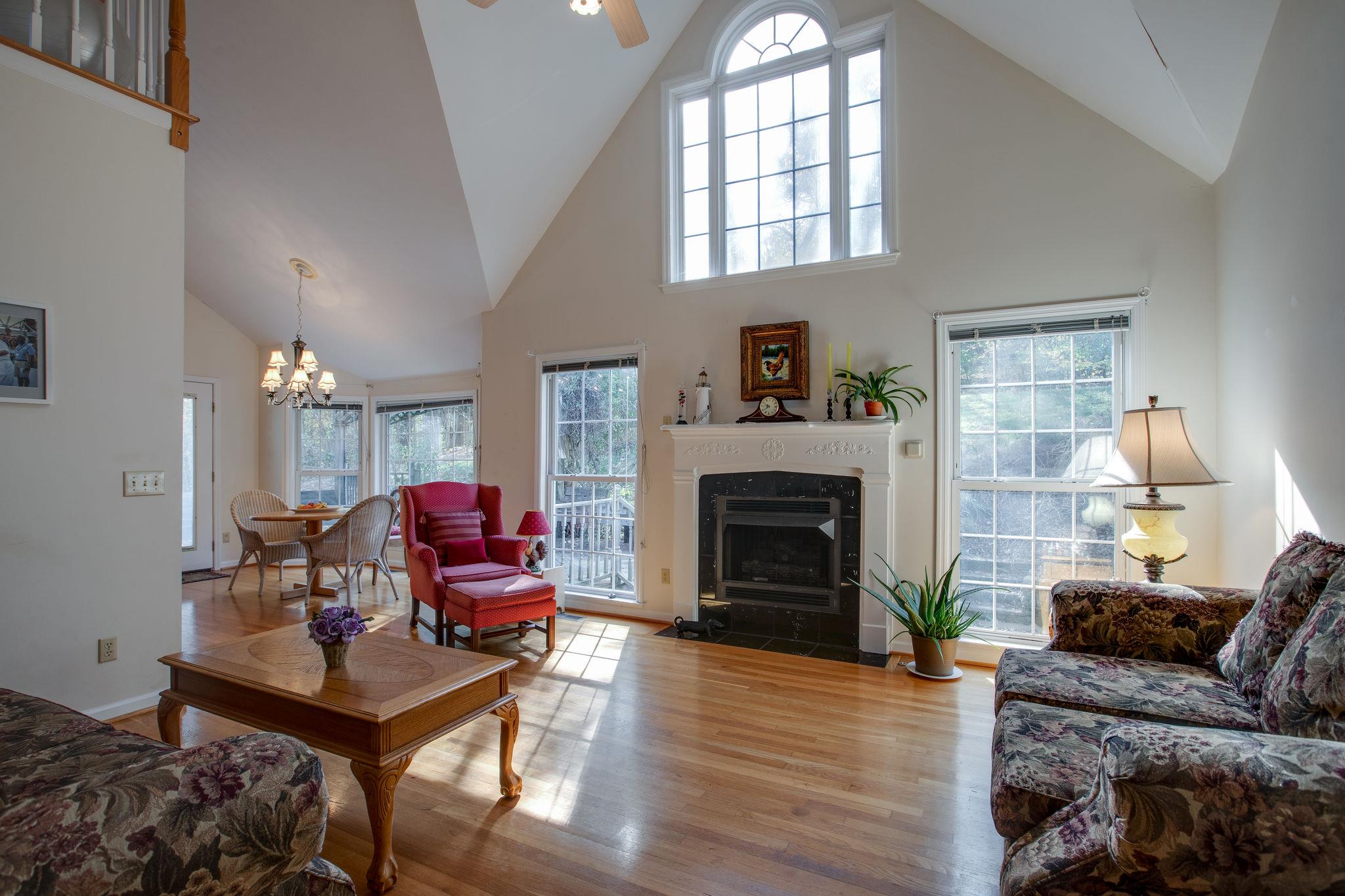 4498 Dyke Bennett Road Franklin, TN 37064 - Photo 22 of 29 a living room with furniture a fireplace and a window