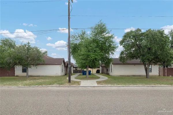 a house with palm tree in front of it
