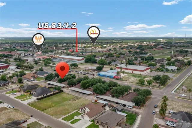 a view of a area with table and chairs