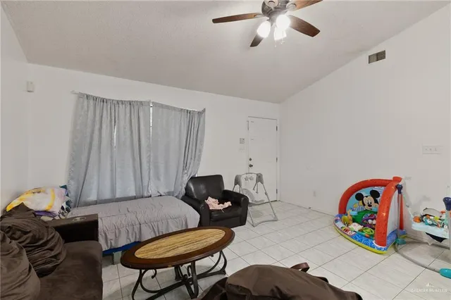 a living room with furniture and a table