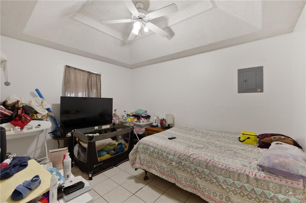 300 North Coyote Boulevard La Joya, TX 78560 - Photo 9 of 24 a bedroom with bed and a flat screen tv
