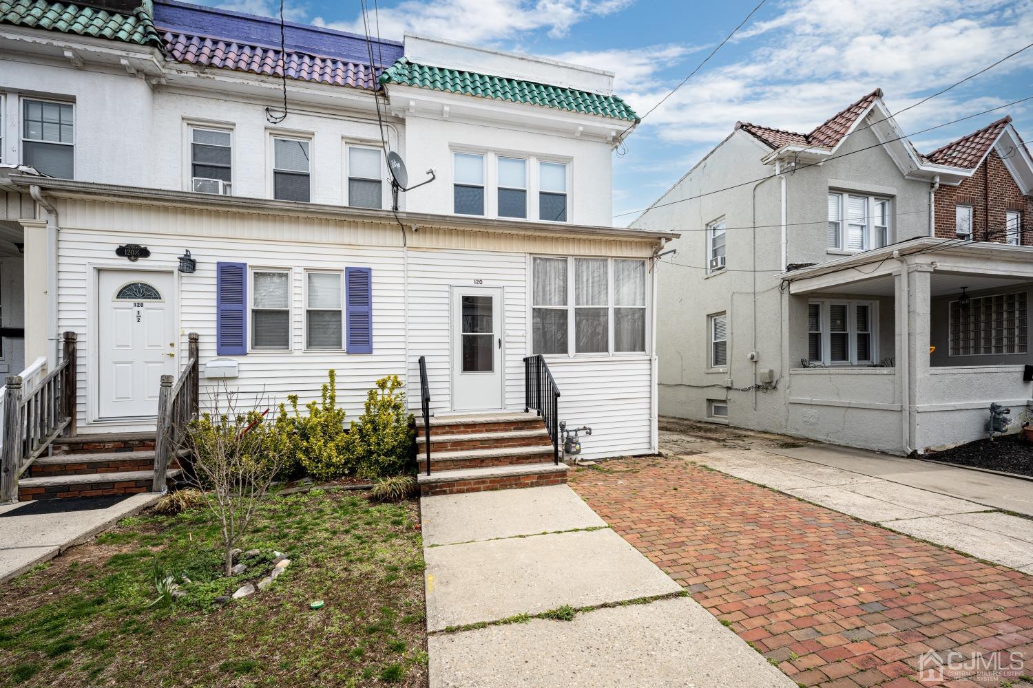 120 Rector Street Perth Amboy, NJ 08861 - Photo 1 of 34 a front view of a house with a garden