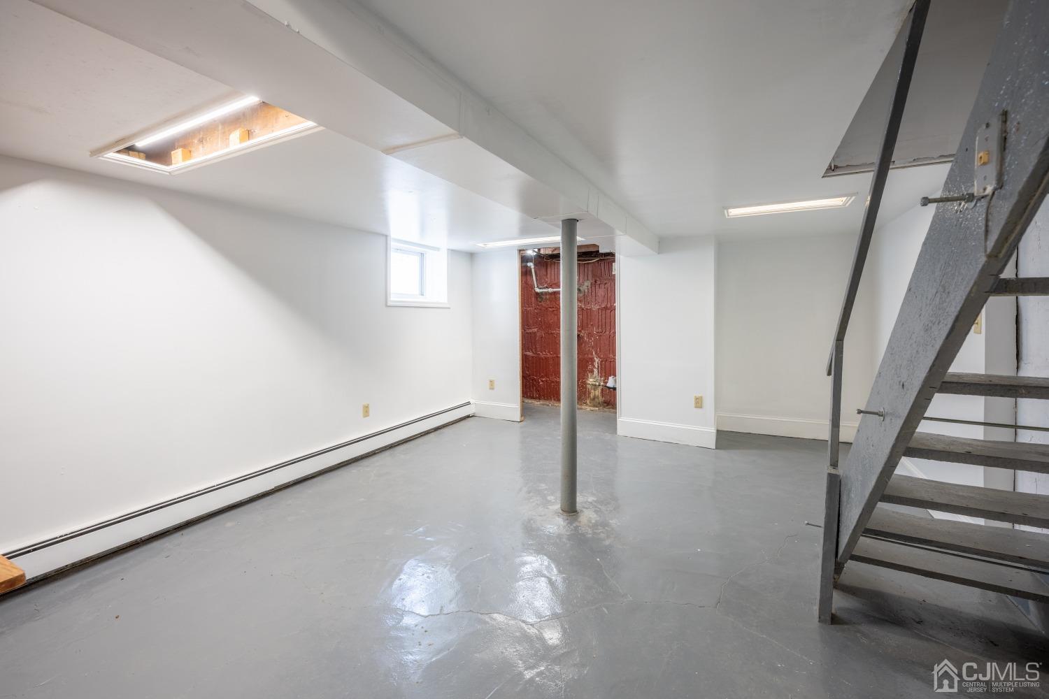 120 Rector Street Perth Amboy, NJ 08861 - Photo 14 of 34 a view of an empty room with stairs