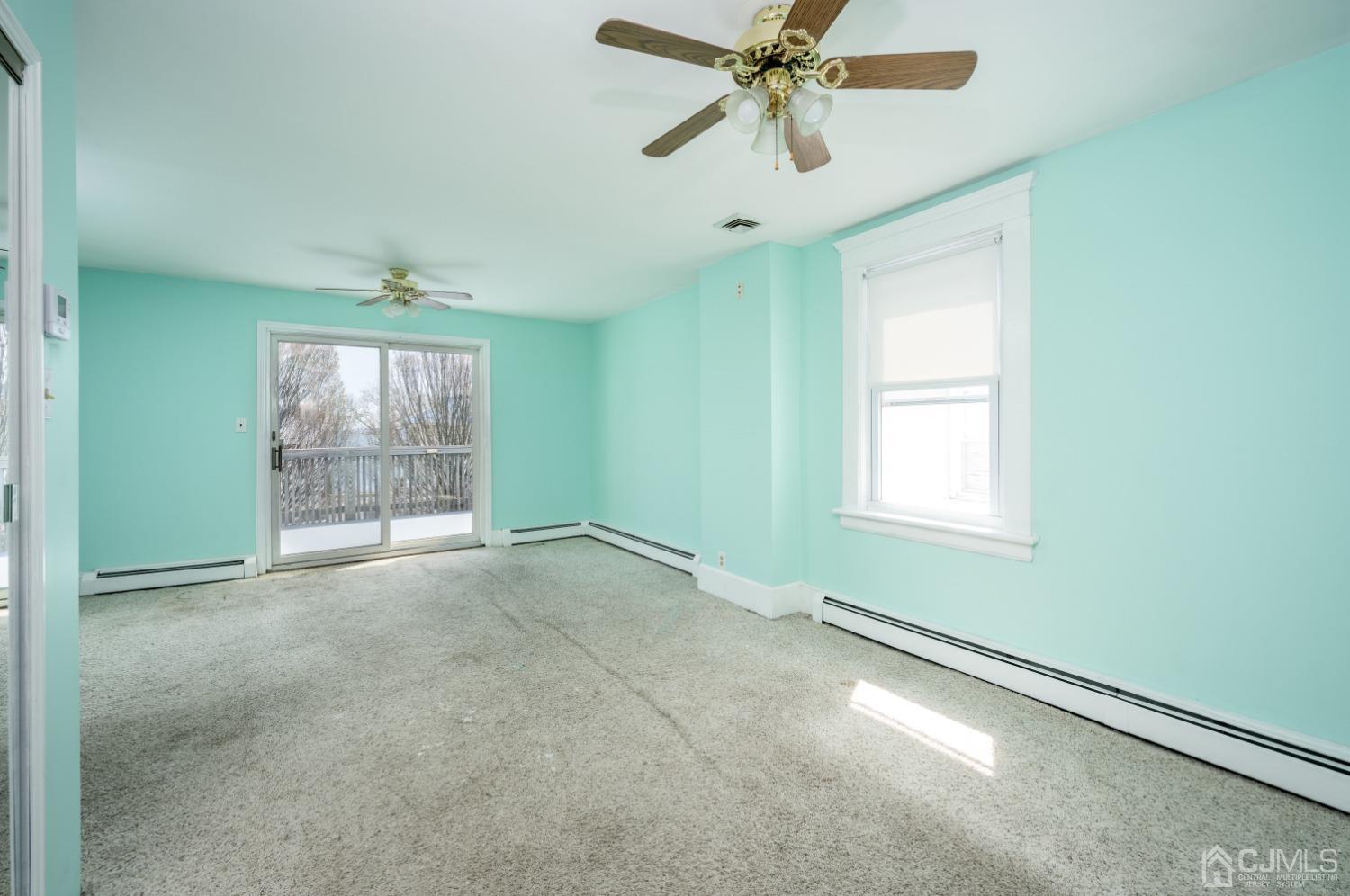 120 Rector Street Perth Amboy, NJ 08861 - Photo 17 of 34 an empty room with windows and fan