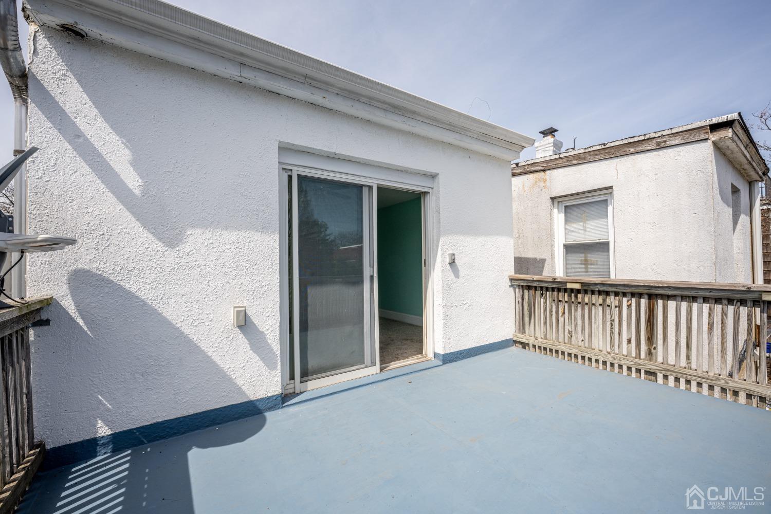 120 Rector Street Perth Amboy, NJ 08861 - Photo 19 of 34 a view of a hallway with window and stairs