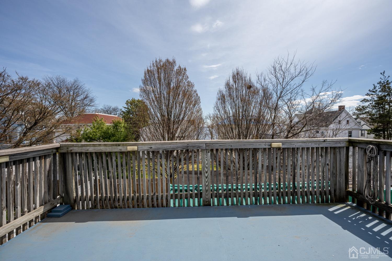 120 Rector Street Perth Amboy, NJ 08861 - Photo 2 of 34 a view of a roof with iron fence