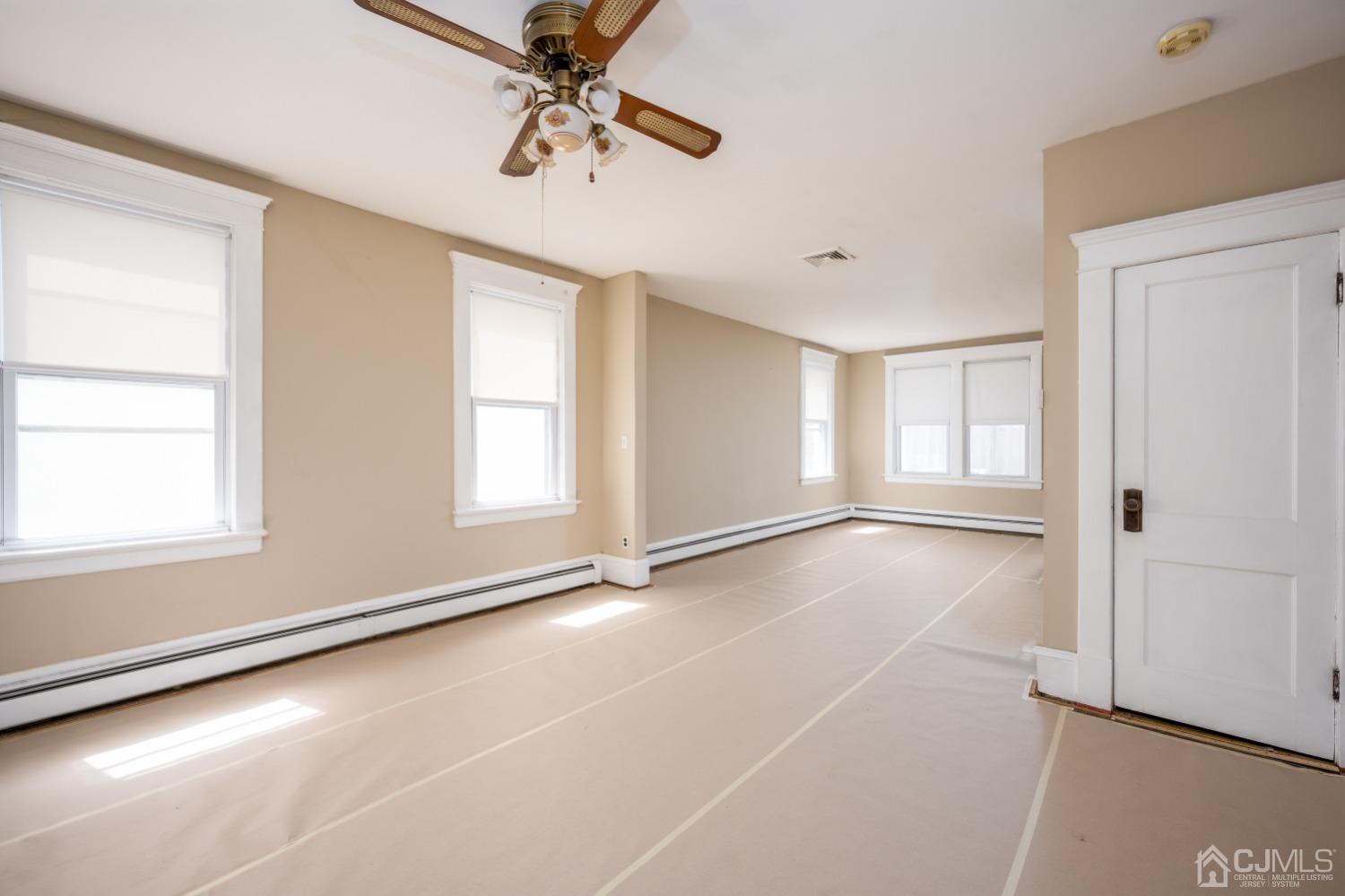 120 Rector Street Perth Amboy, NJ 08861 - Photo 5 of 34 a view of an empty room with a window