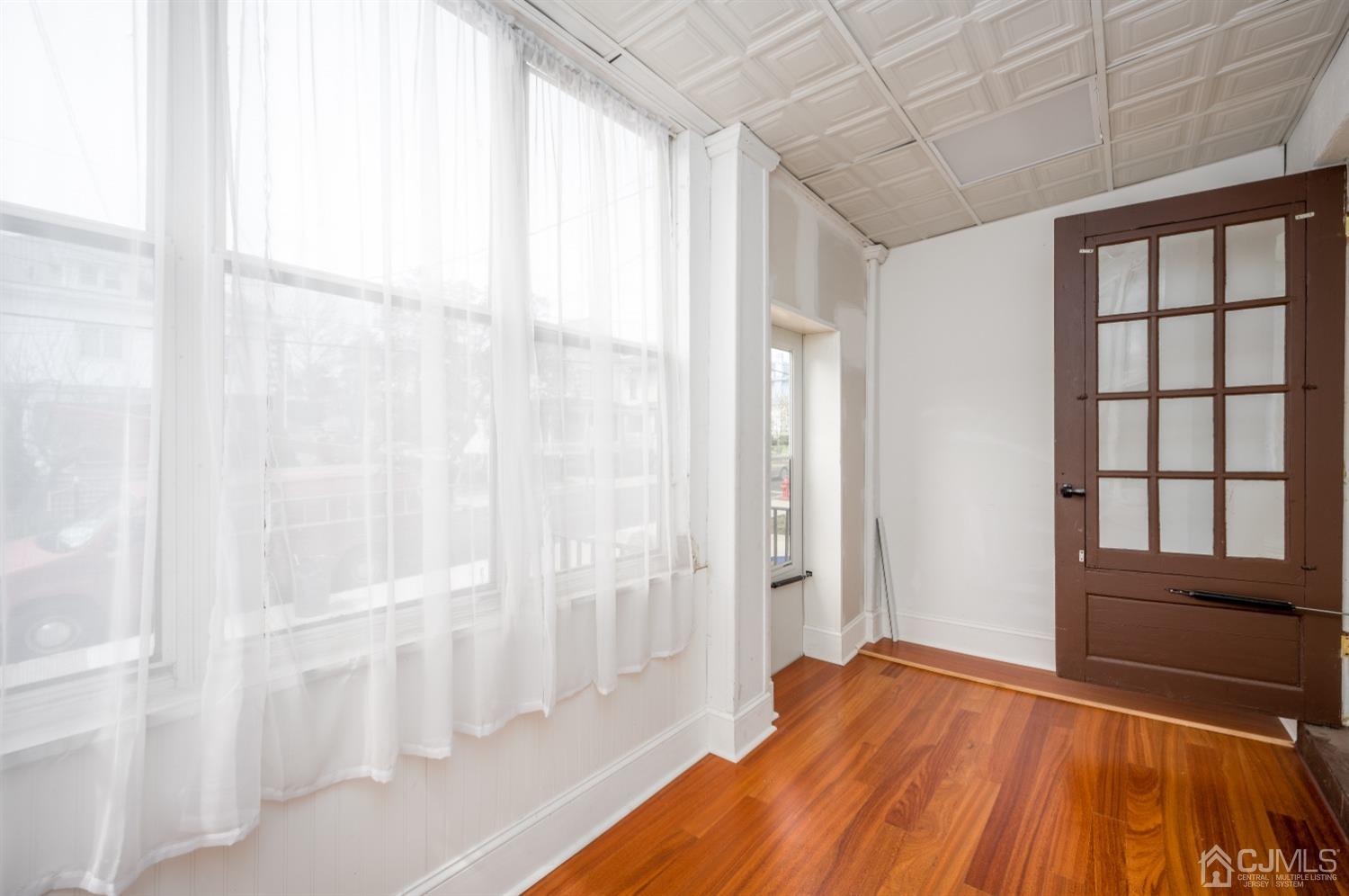 120 Rector Street Perth Amboy, NJ 08861 - Photo 7 of 34 a view of room with window and hardwood floor