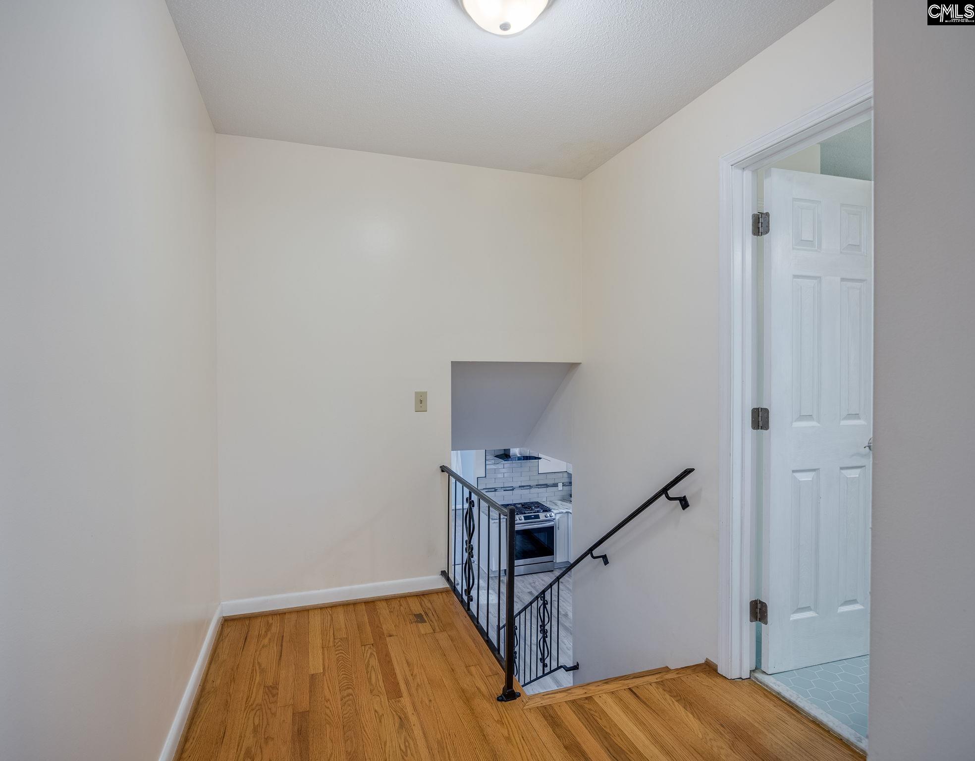 560 Edisto Street Batesburg, SC 29006 - Photo 36 of 49 a view of a room with wooden floor and staircase