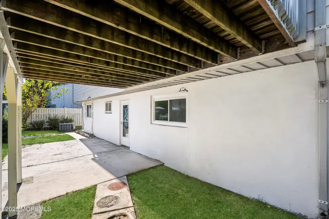 a view of a house with backyard and a slide