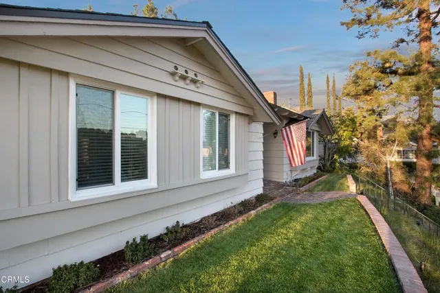 a view of a house with a small yard
