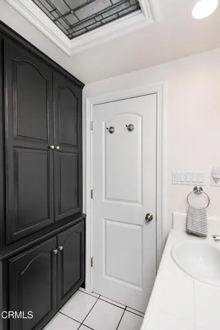 a hallway with closet and wooden floor
