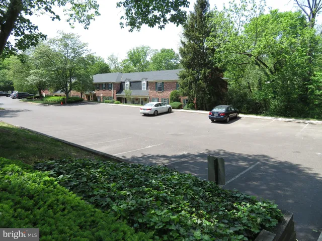 a view of street with parked cars