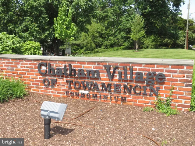 a view of a chairs and bench in the patio