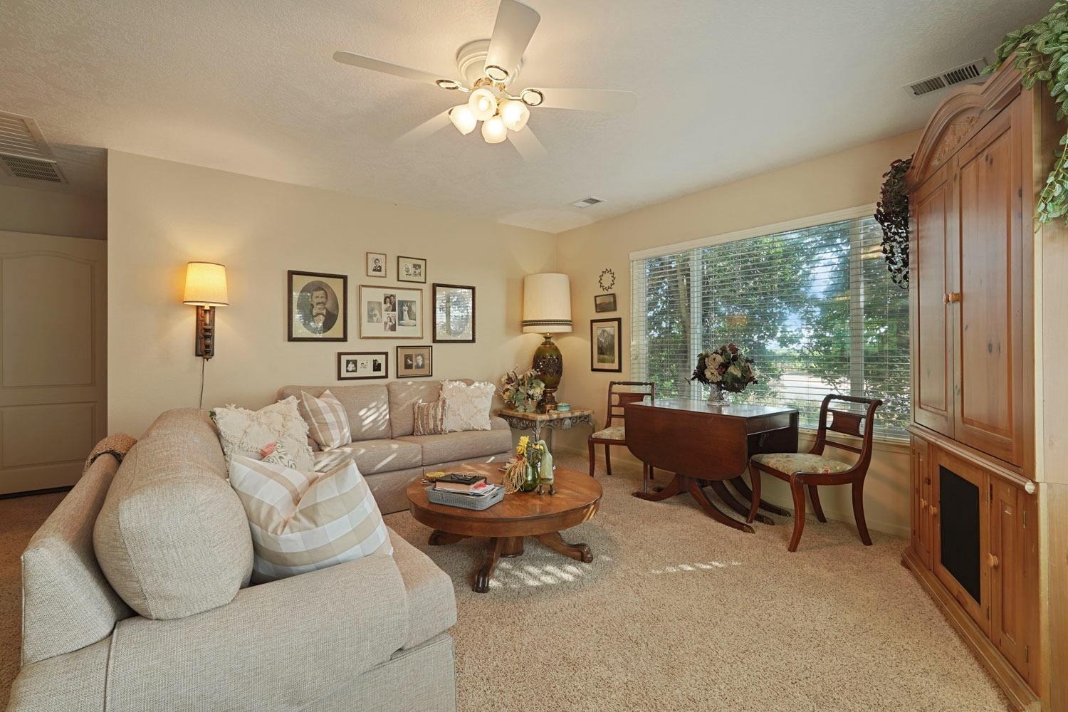 14267 East Peltier Road Acampo, CA 95220 - Photo 12 of 65 a living room with furniture and a large window