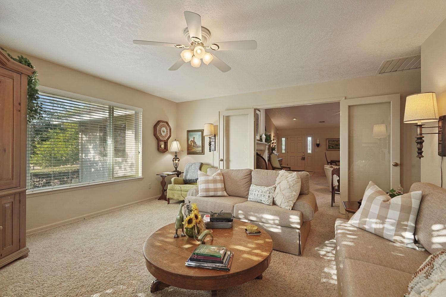 14267 East Peltier Road Acampo, CA 95220 - Photo 13 of 65 a living room with furniture and a large window