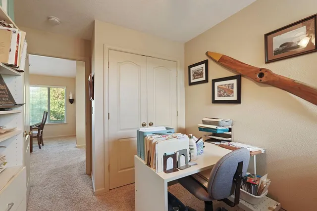a kitchen with a stove and a refrigerator