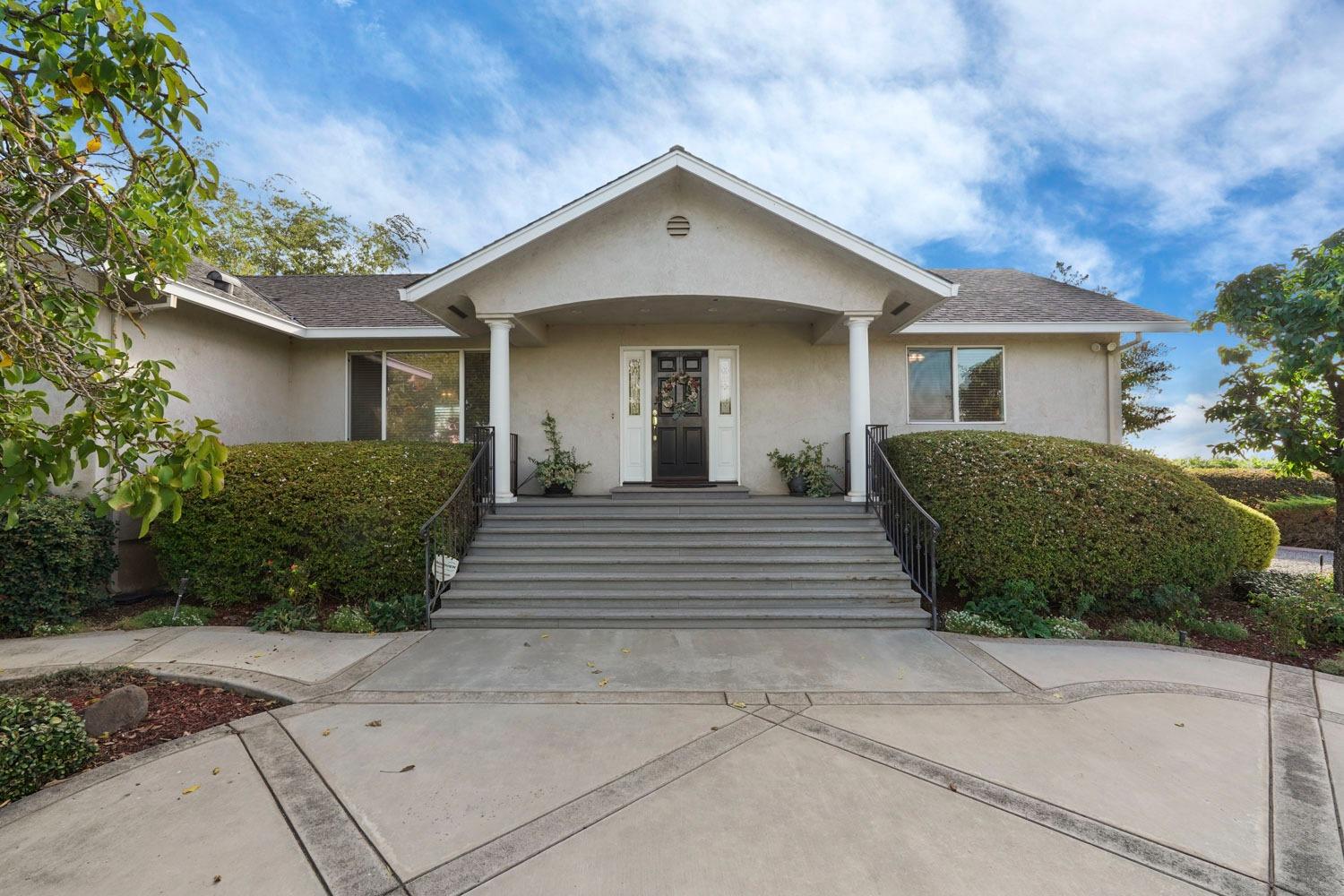 14267 East Peltier Road Acampo, CA 95220 - Photo 2 of 65 a front view of a house with a yard