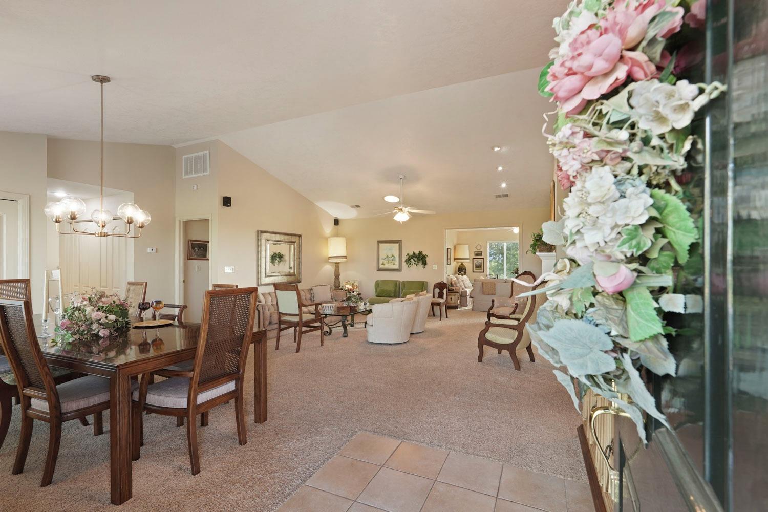 14267 East Peltier Road Acampo, CA 95220 - Photo 5 of 65 a view of a dining room with furniture and chandelier