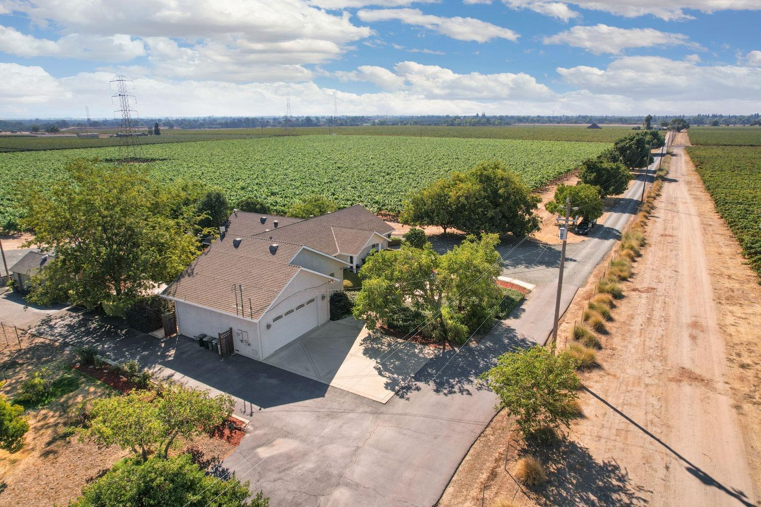 14267 East Peltier Road Acampo, CA 95220 - Photo 56 of 65 an aerial view of a house with a garden