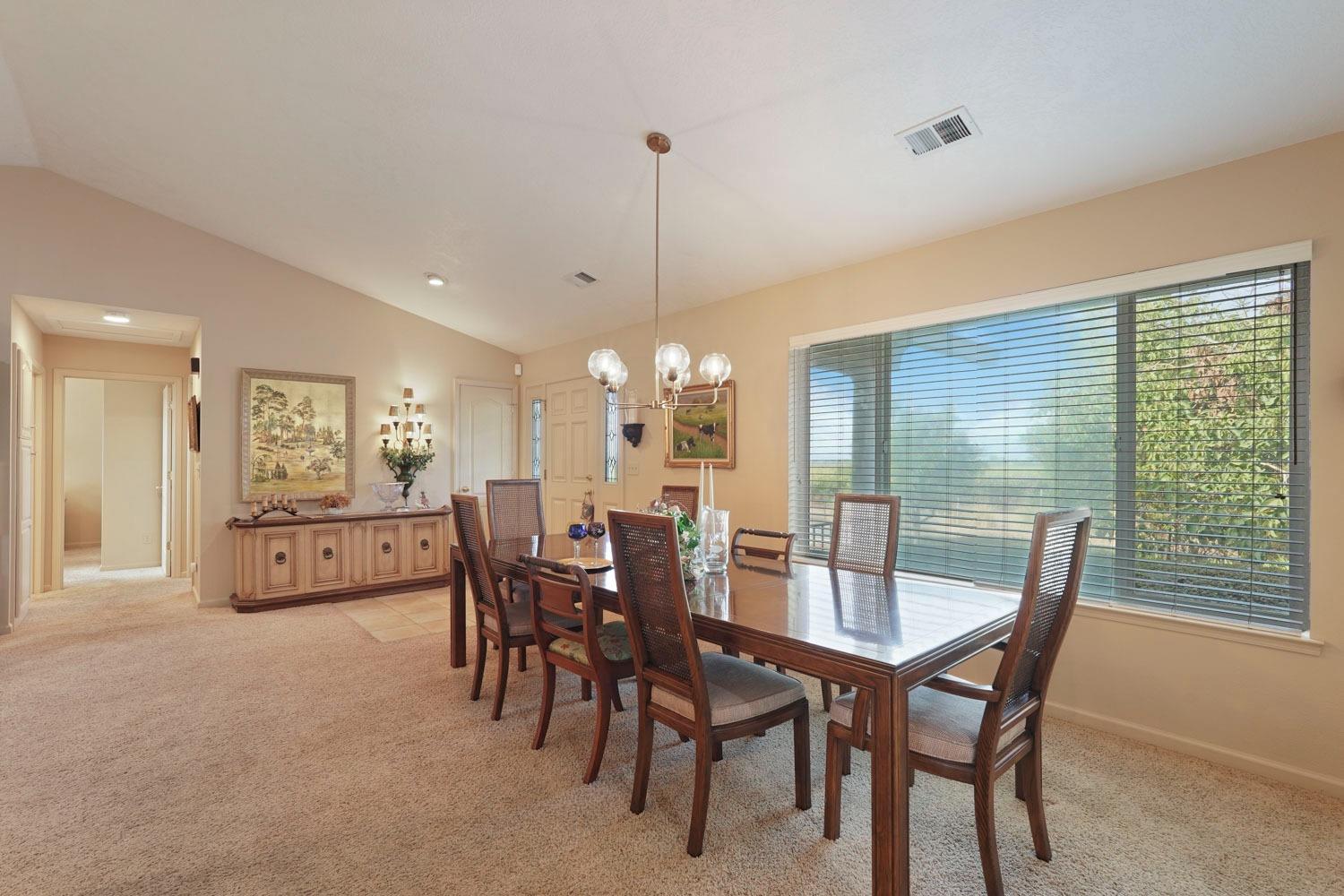 14267 East Peltier Road Acampo, CA 95220 - Photo 7 of 65 a dining room with furniture a chandelier and window